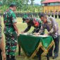 Penandatangan dan Penyerahan Laporan Hasil TMMD ke-117 dari Dansatgas ke Pemerintah Kabupaten Karimun. Foto: Rr